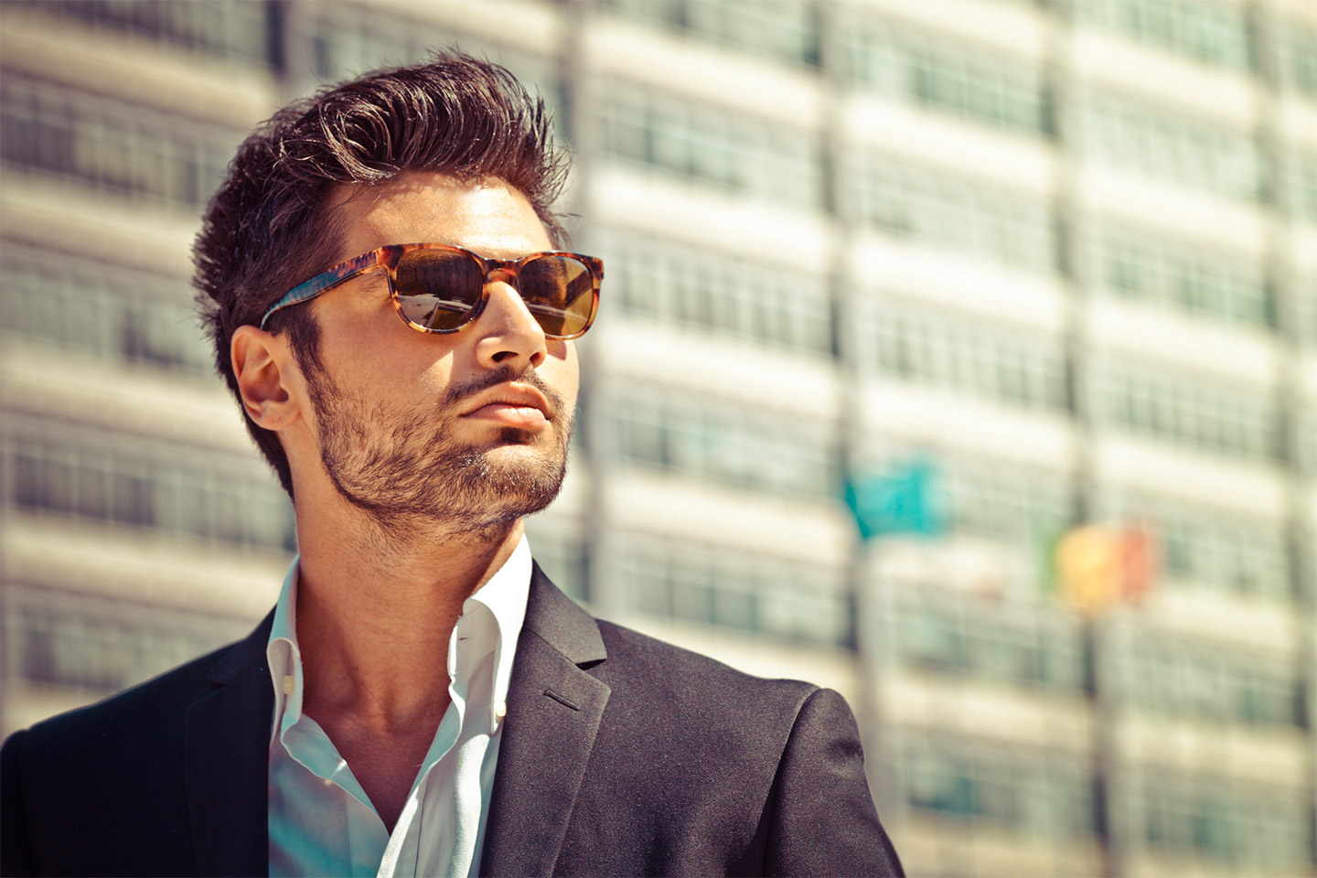 Handsome man wearing sunglasses with nice hair
